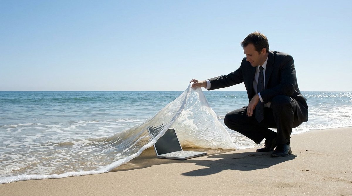 SUBJECT Is Crouching on the Beach Lifting a Wave Like a
